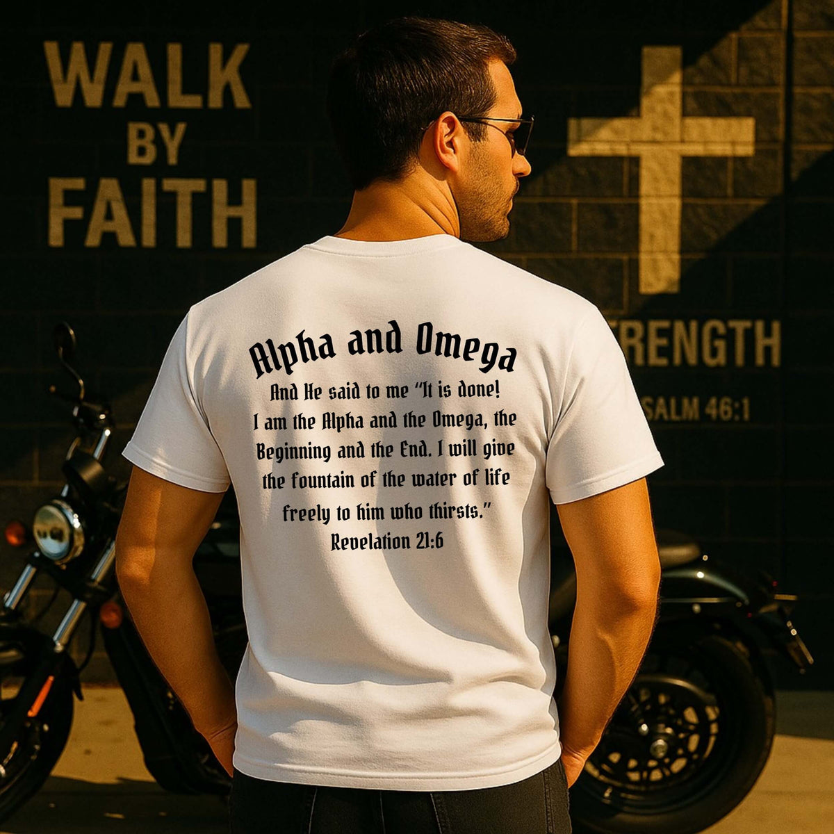 Alpha and Omega T-shirt white short sleeve. On the back is printed in black font "Alpha and Omega - And He said to me "it is done! I am the Alpha and the Omega, the Beginning and the End. I will give the fountain of the water of life freely to him who thirsts." Rev. 21:6