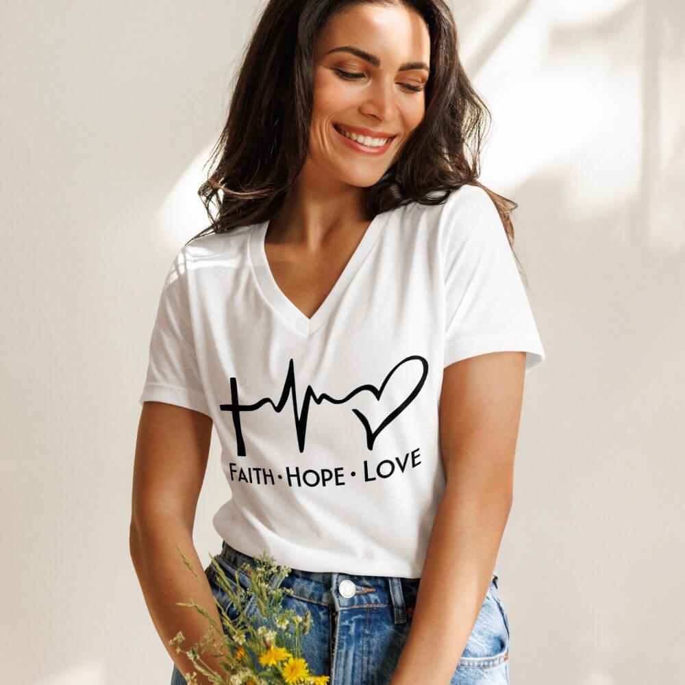Faith Hope love women's V-neck t-shirt white.  Design with a cross, heartbeat and heart printed in black on the front chest above "Faith Hope Love".