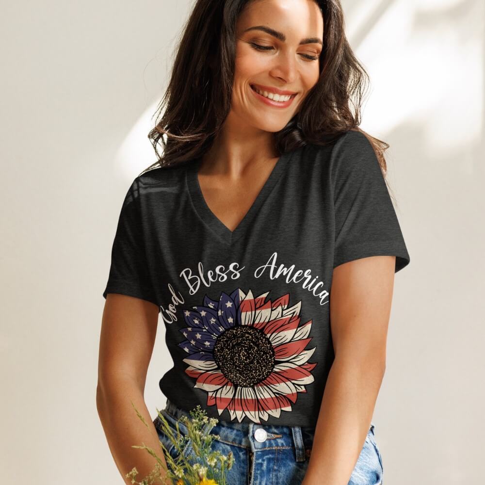 God Bless America V-neck women's t-shirt heather grey.  American Flag colored sunflower printed on front chest below "God Bless America" in white.