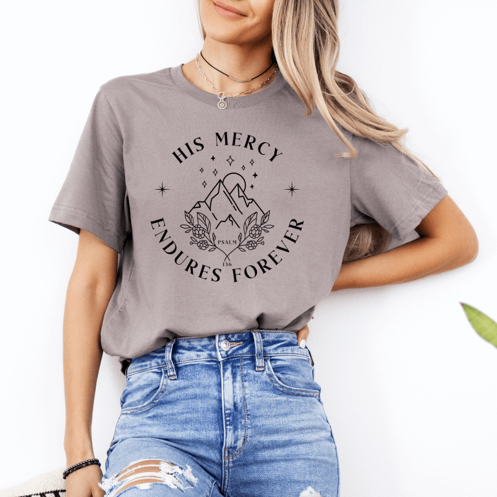 His Mercy Endures forever short sleeve women's t-shirt pebble.  Design of mountains in black with "His Mercy Endures Forever" printed on the front around the design. "Psalm 136" printed in small font.