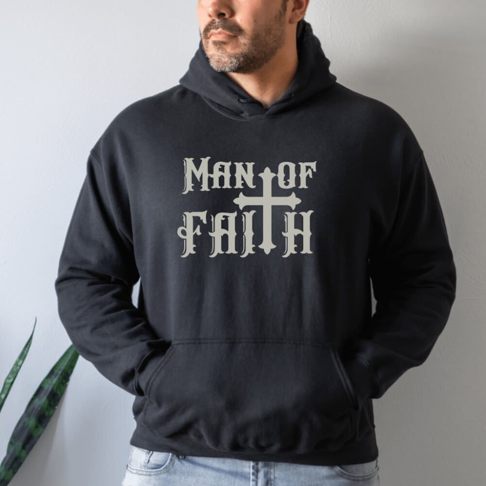 Man of Faith Hoodie black. On the front chest is printed "Man of Faith" in grey font with a cross as the "t".
