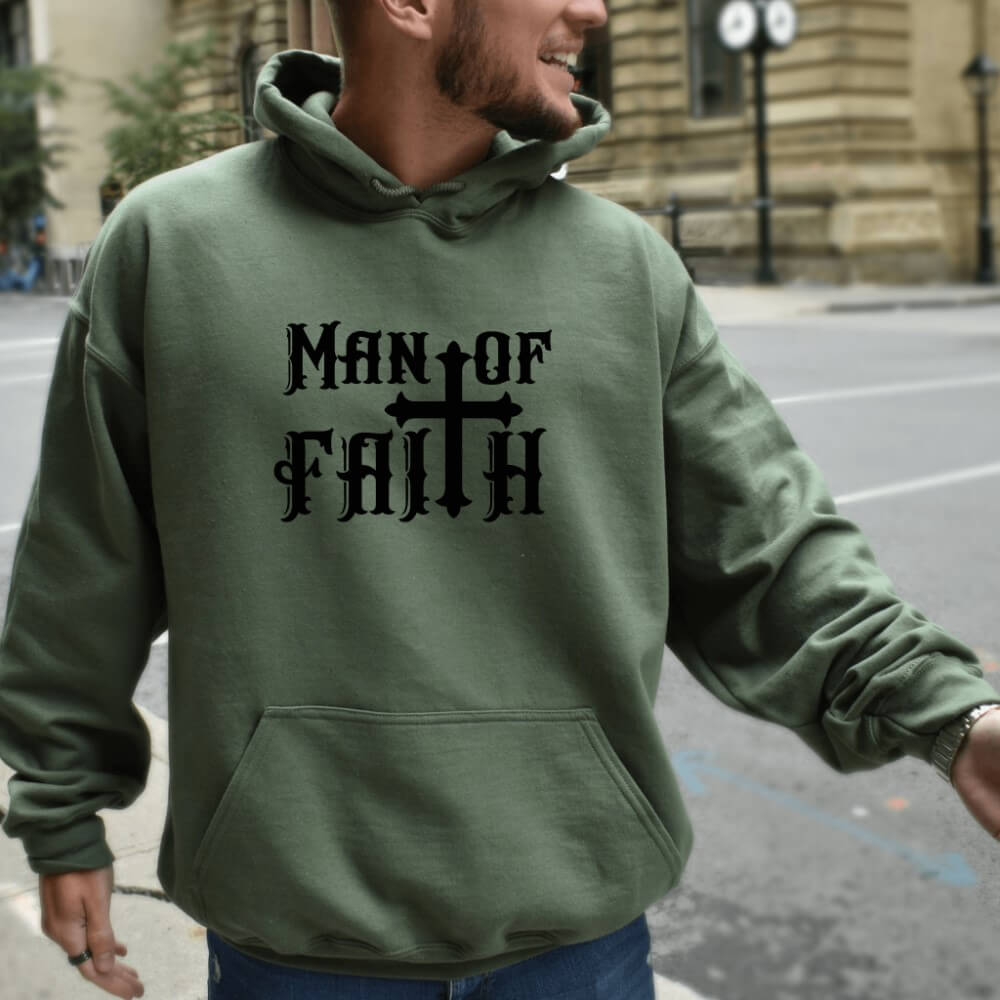 Man of Faith Hoodie military green. On the front chest is printed "Man of Faith" in black font with a cross as the "t".