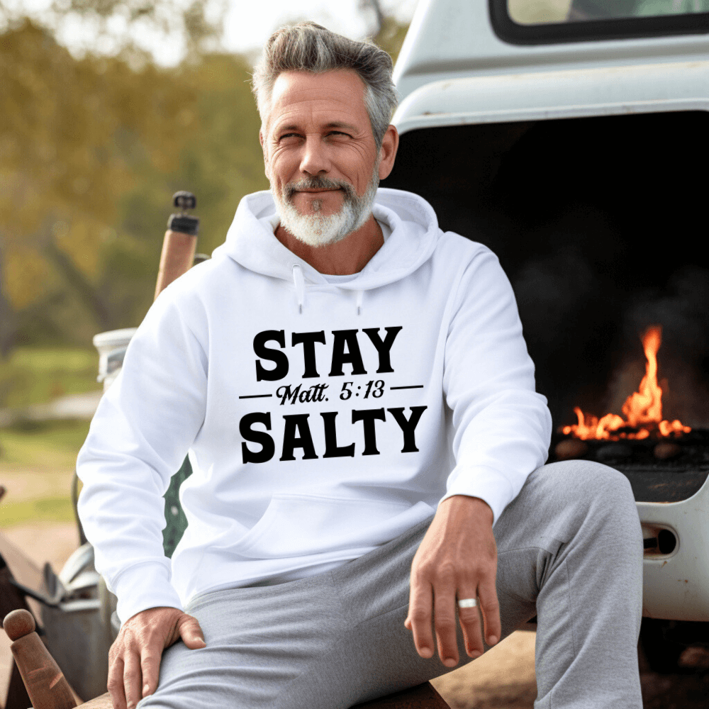 Stay Salty Hoodie white. On the front is printed "Stay Salty Matt. 5:13" in large black font.