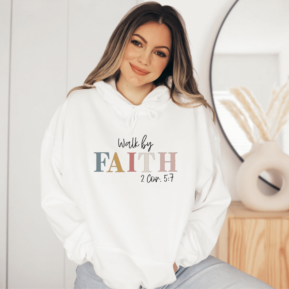 Walk By Faith hoodie white.  On the front chest is printed "Walk by FAITH 2 Cor. 5:7" in multicolored pastels.