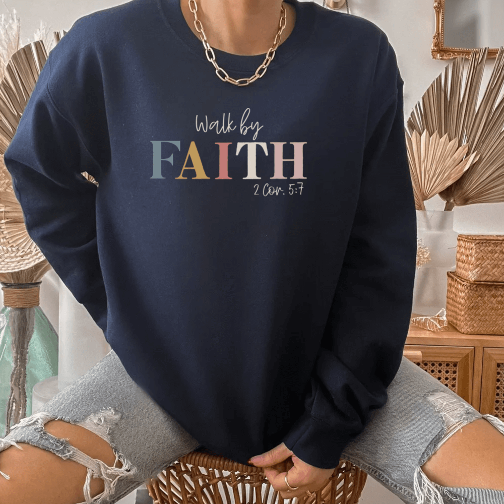 Walk By Faith crewneck sweatshirt navy. On the front chest is printed "Walk by FAITH 2 Cor. 5:7"