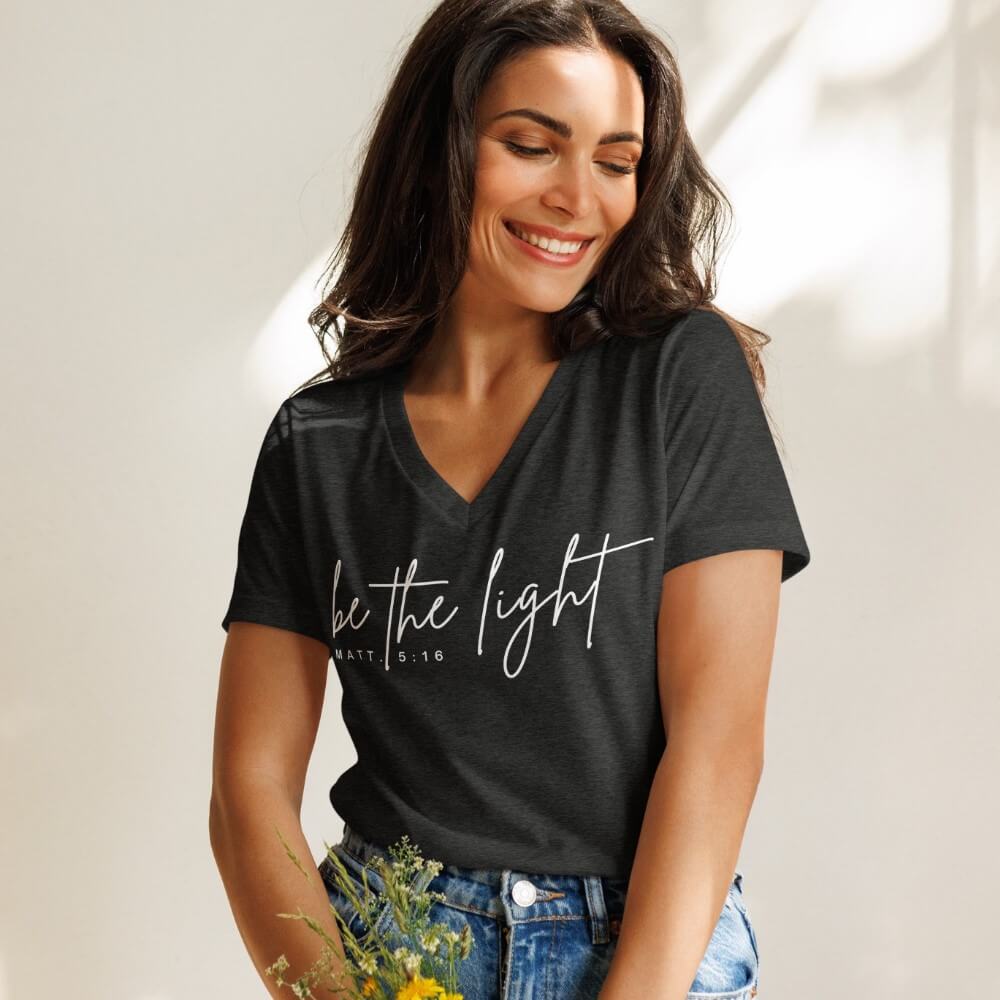 Be The Light women&#39;s V-neck t-shirt heather grey short sleeve.   &quot;be the light - Matt. 5:16&quot; printed in white on front chest. 