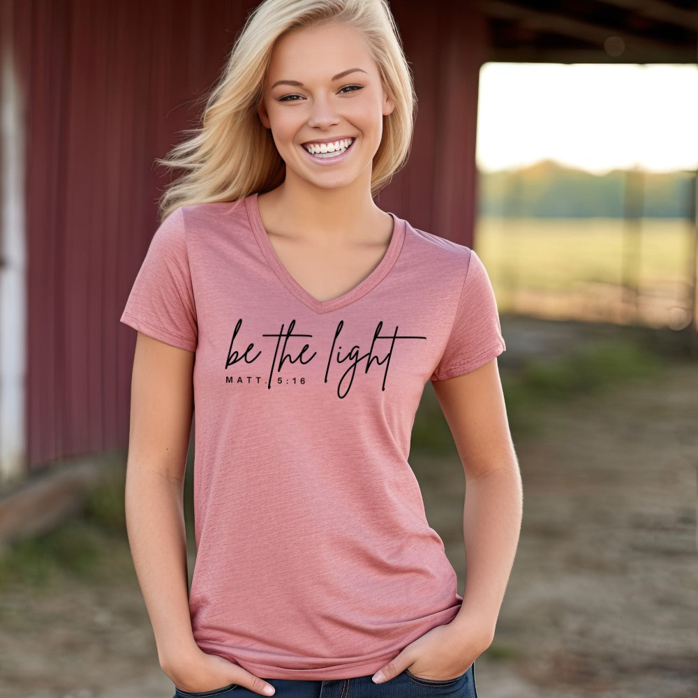 Be The Light women&#39;s V-neck t-shirt heather mauve short sleeve.   &quot;be the light - Matt. 5:16&quot; printed in black on front chest. 